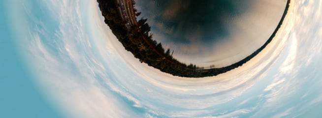 City skyline and the sky above distorted by fisheye effect, so that they looks like an acutual eye