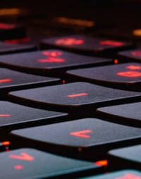 close up of keybord keys backlit in red