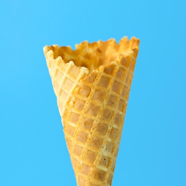 Ice-cream cone on a blue bakcground